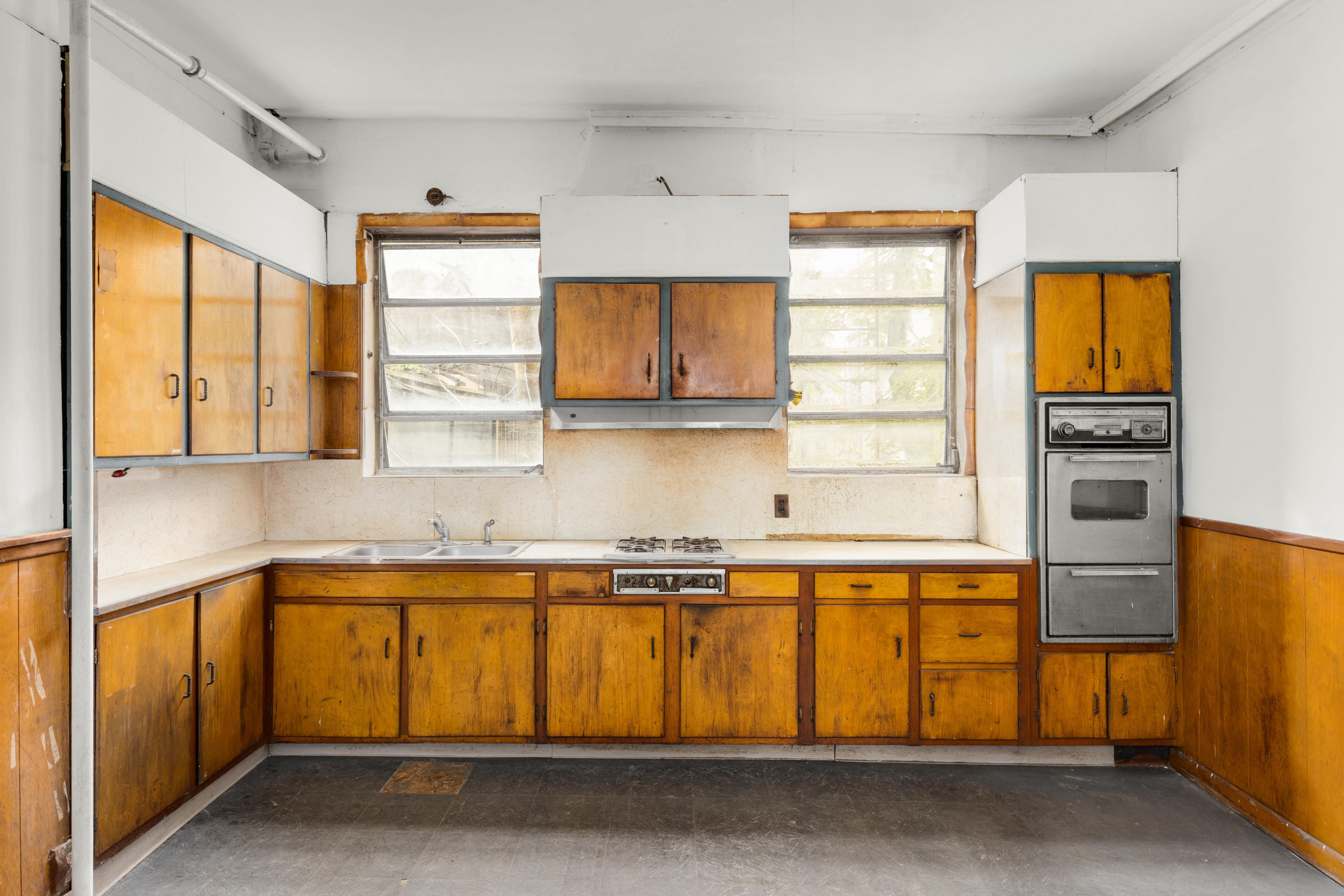 46 Willow Place Brooklyn, NY 11201 - Photo 7 of 31 a kitchen with a window wooden floor and stainless steel appliances