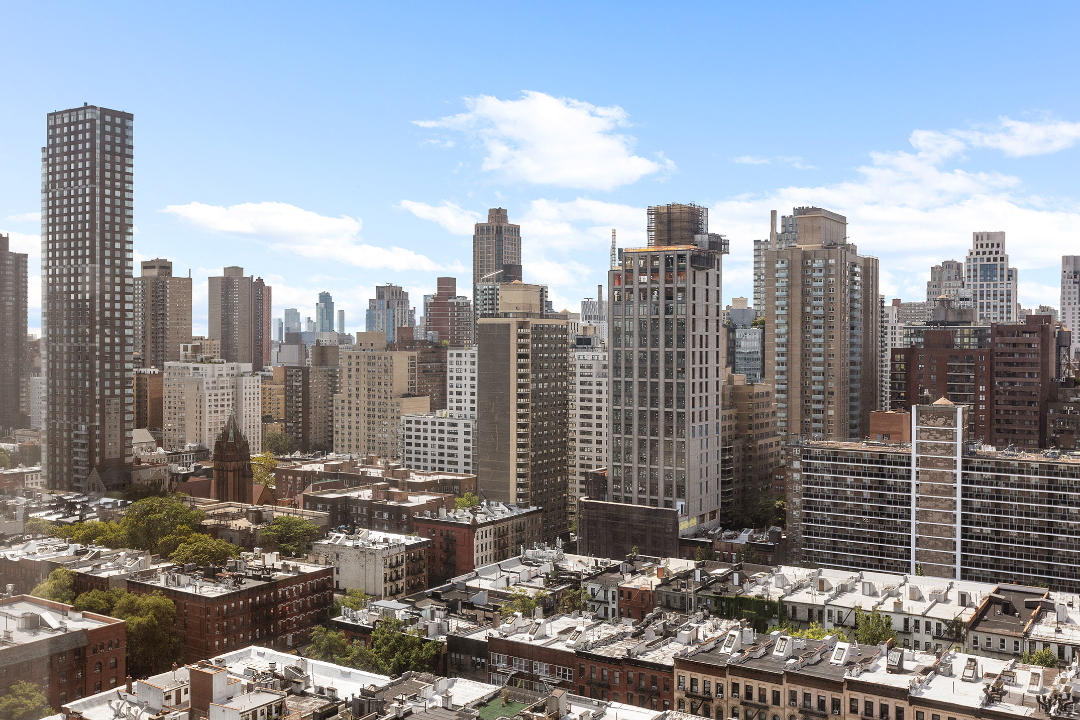 1619 3rd Avenue, Unit 21H Manhattan, NY 10128 - Photo 9 of 16 a view of a city with tall buildings