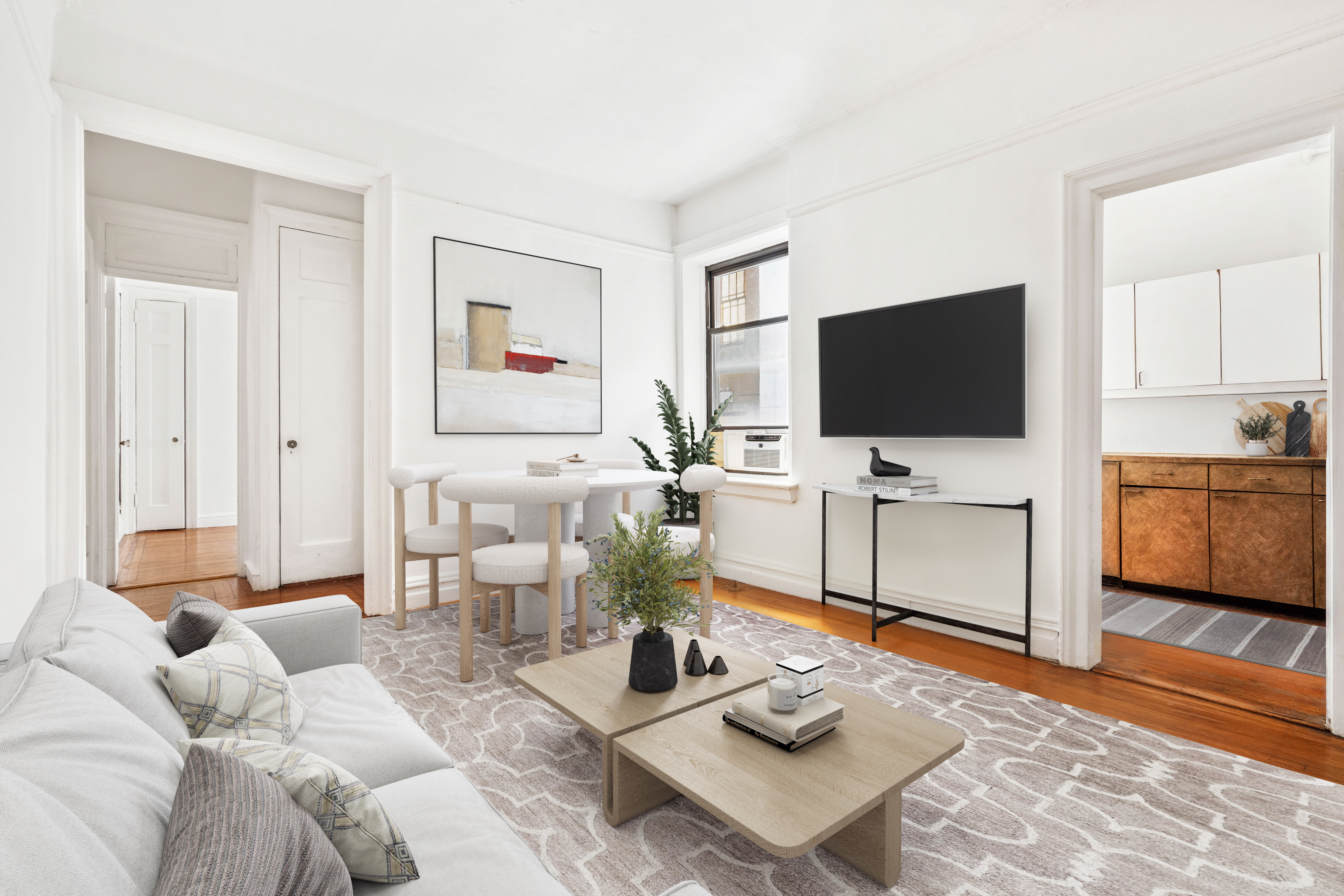 130 West 16th Street, Unit 3 Manhattan, NY 10011 - Photo 2 of 8 a living room with furniture and a flat screen tv