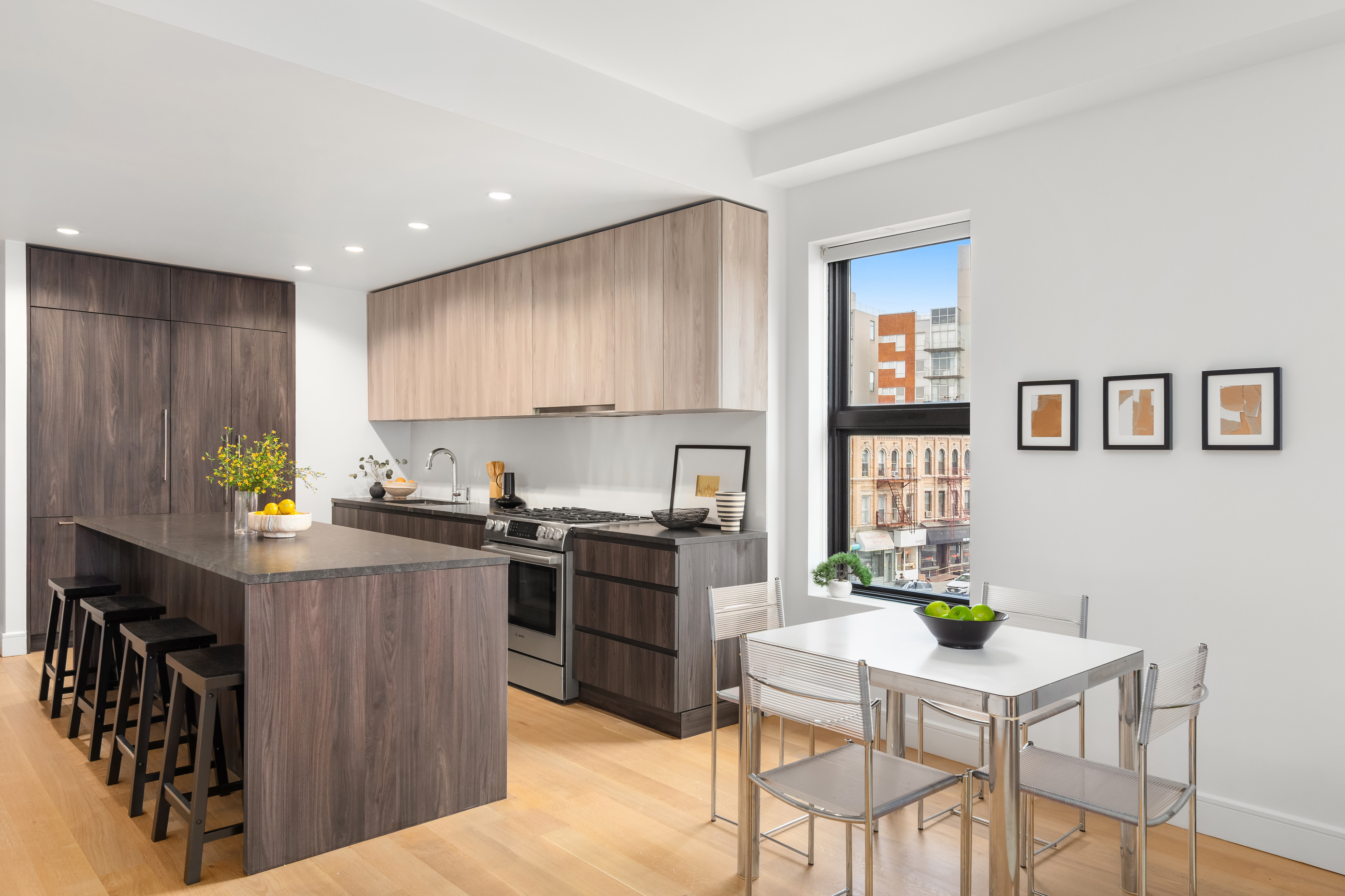 868 Lorimer Street, Unit 3C Brooklyn, NY 11222 - Photo 3 of 11 a kitchen with stainless steel appliances granite countertop a stove top oven a sink dishwasher and a refrigerator