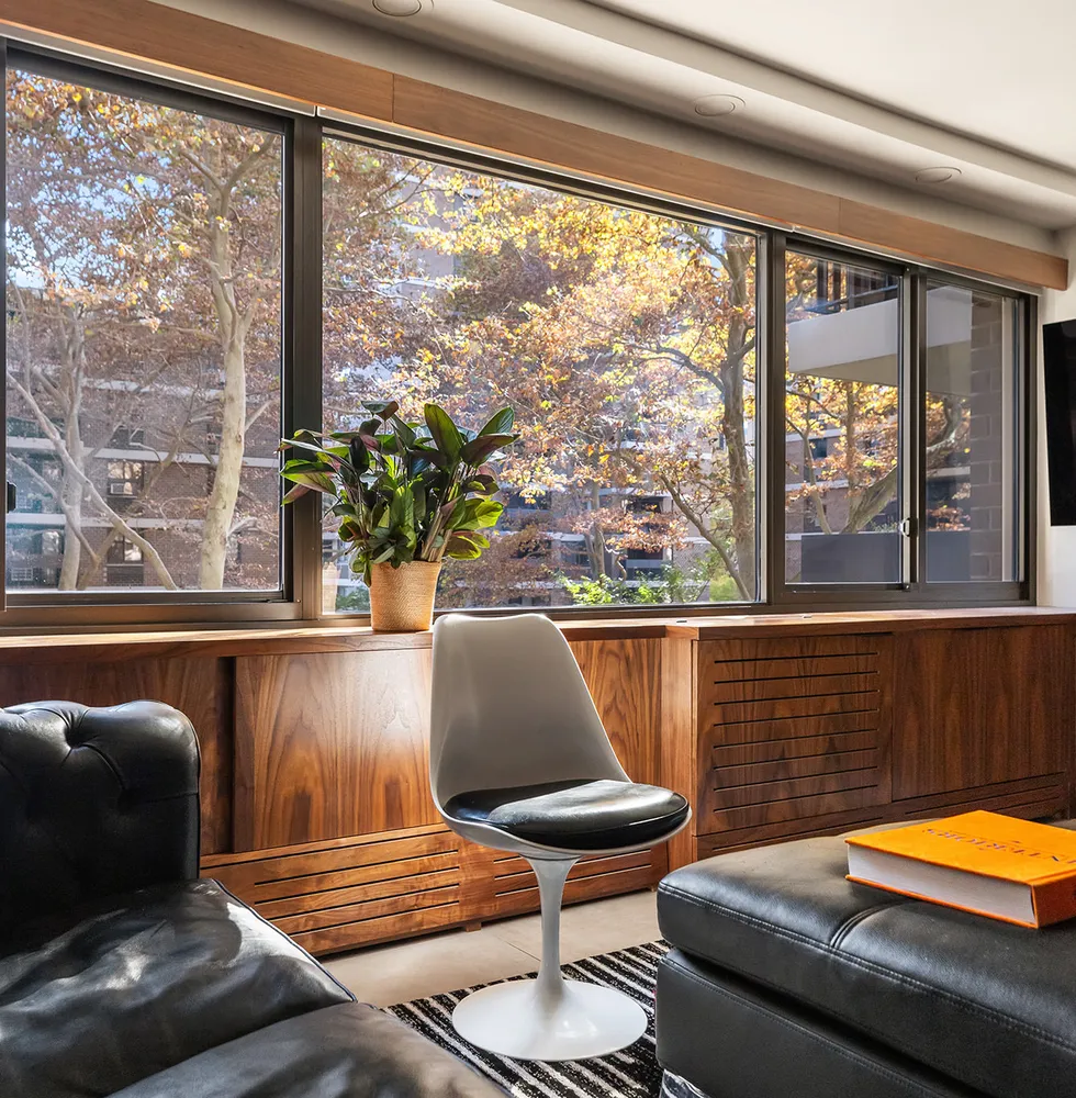 a living room with a couch and a large window