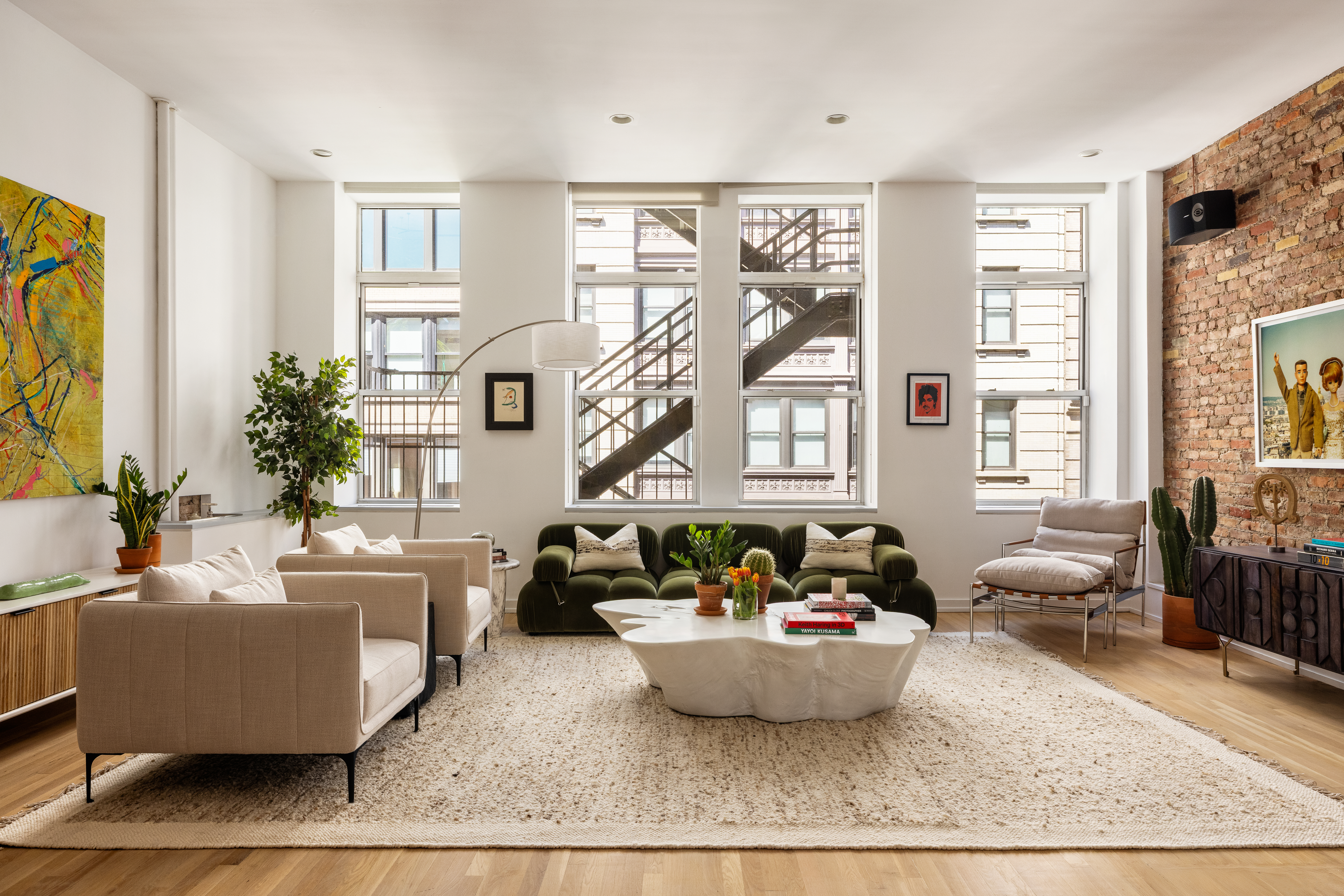 56 East 11th Street, Unit 5 Manhattan, NY 10003 - Photo 16 of 18 a living room with furniture and a large window