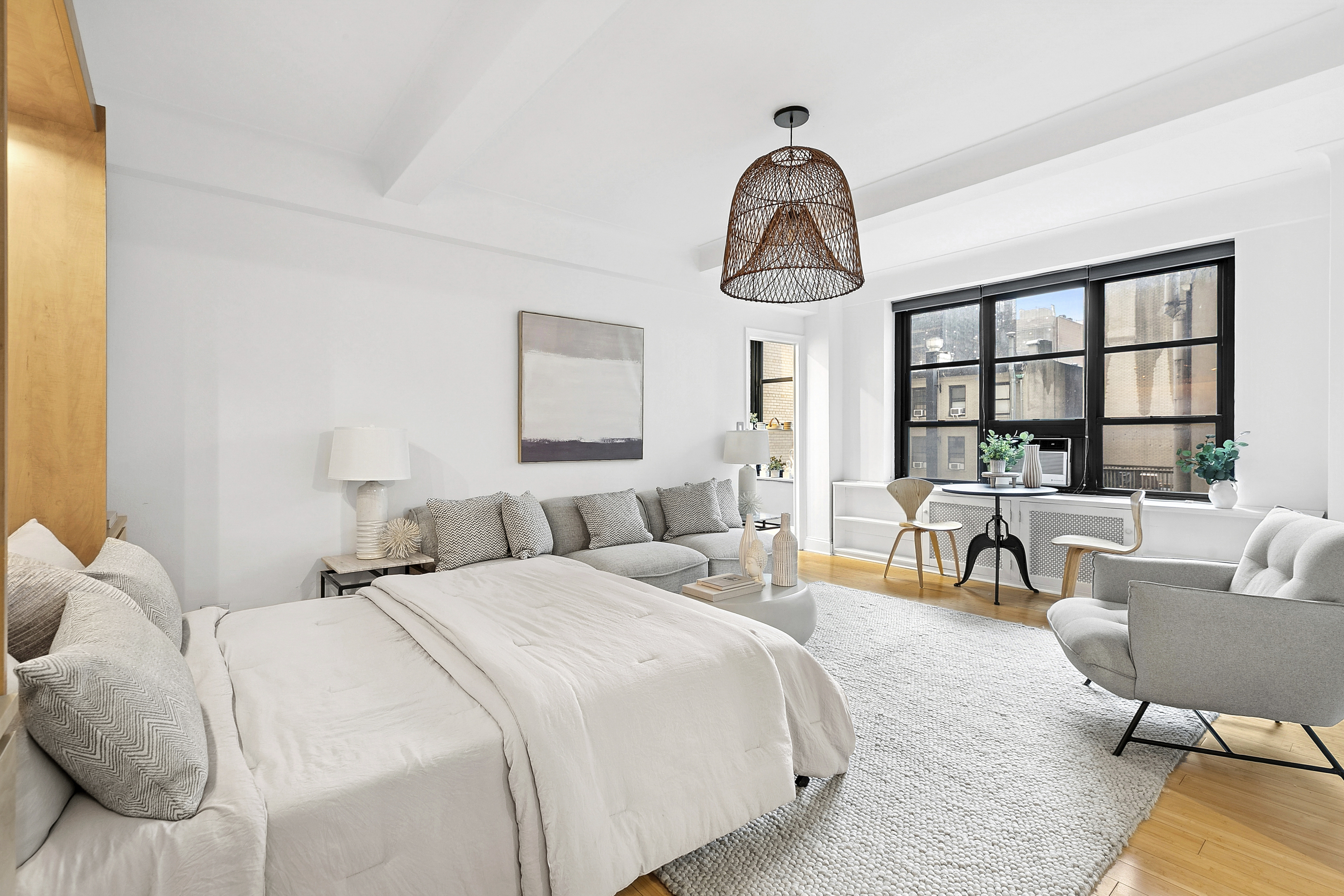 235 East 22nd Street, Unit 4M Manhattan, NY 10010 - Photo 3 of 14 a bedroom with bed and a large window