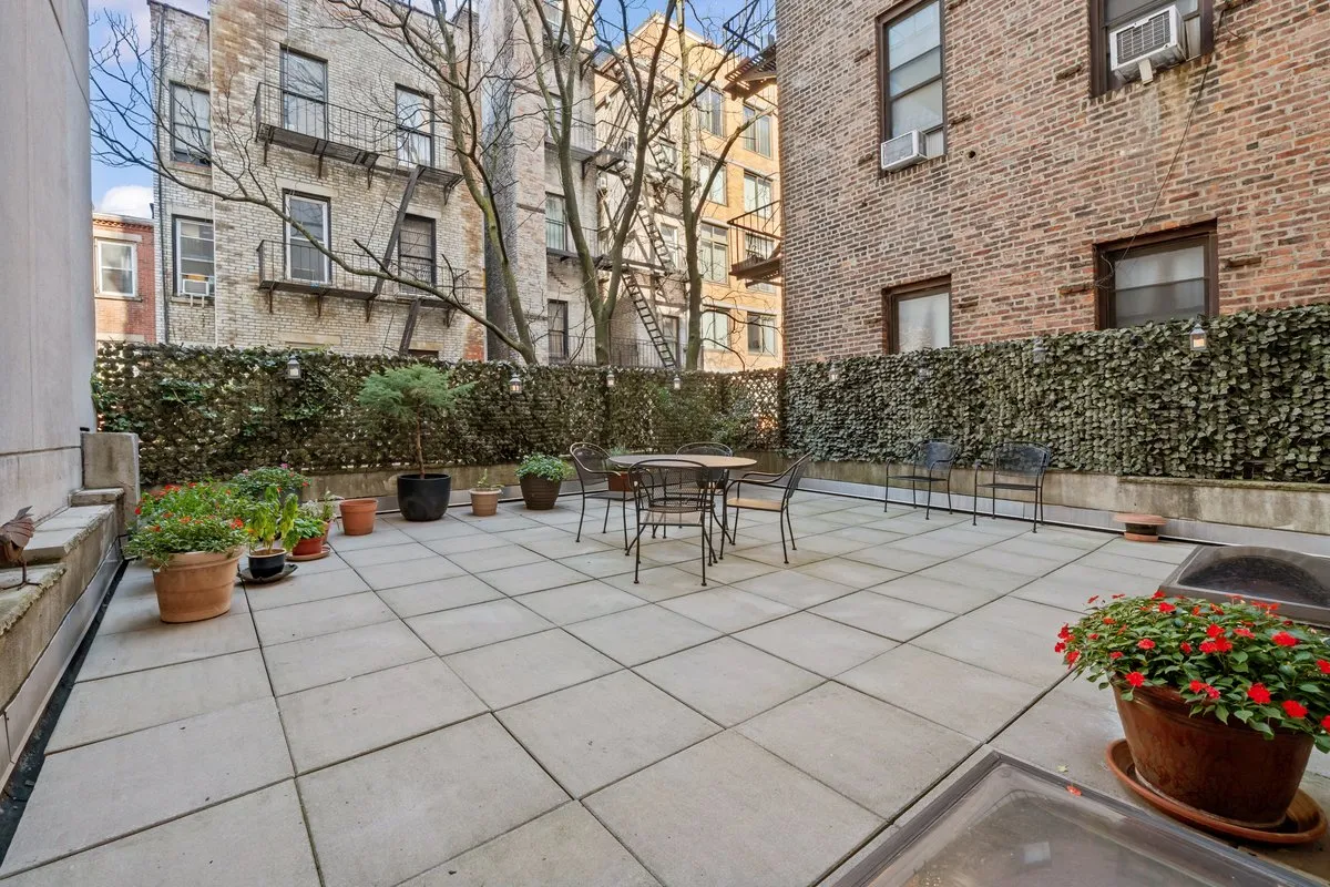 a white bench sitting in front of a building