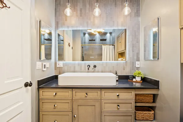 a bathroom with a sink and a mirror