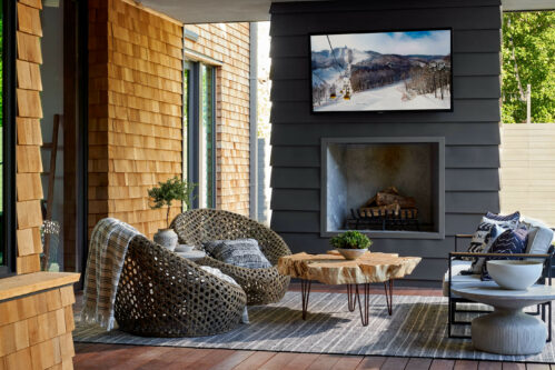 5716 Stonegate Road Dallas, TX 75209 - Photo 24 of 25 a living room with furniture and a fireplace