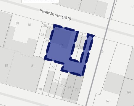 a view of a hallway with stairs