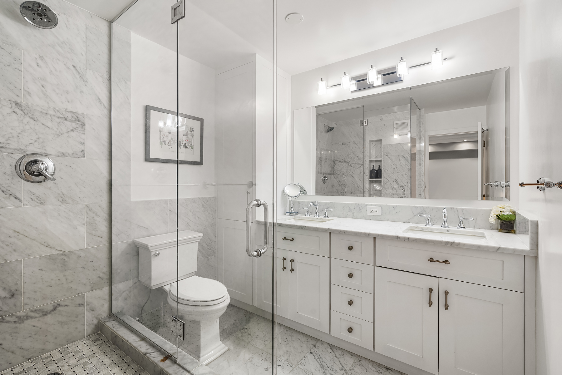 178 East 80th Street, Unit 3A Manhattan, NY 10075 - Photo 8 of 14 a bathroom with a granite countertop toilet a sink and a mirror