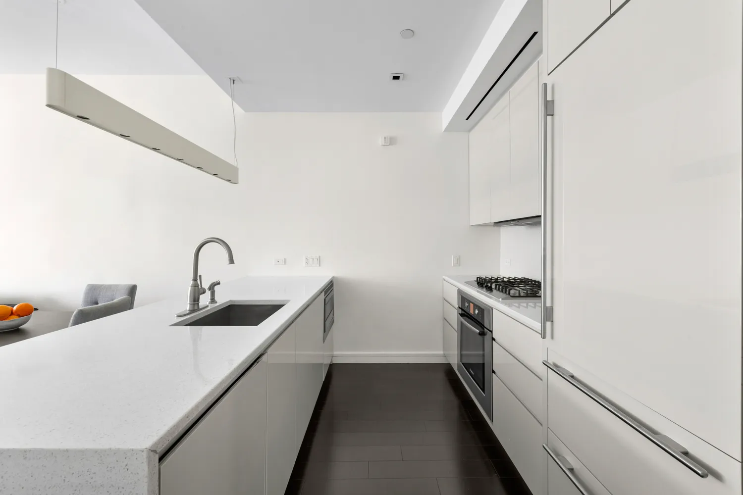 a kitchen with stainless steel appliances and white cabinets