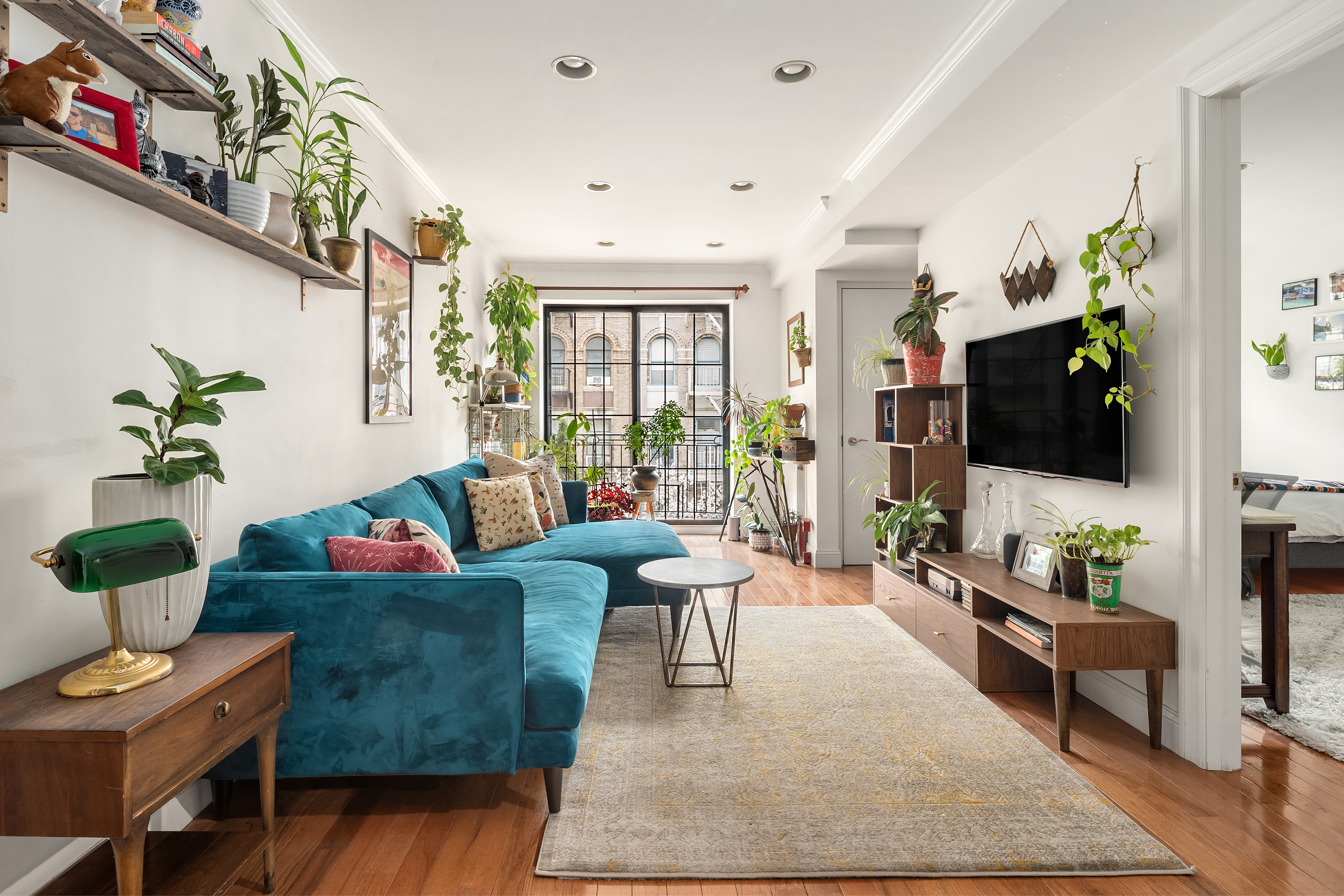 a living room with fireplace furniture and a flat screen tv