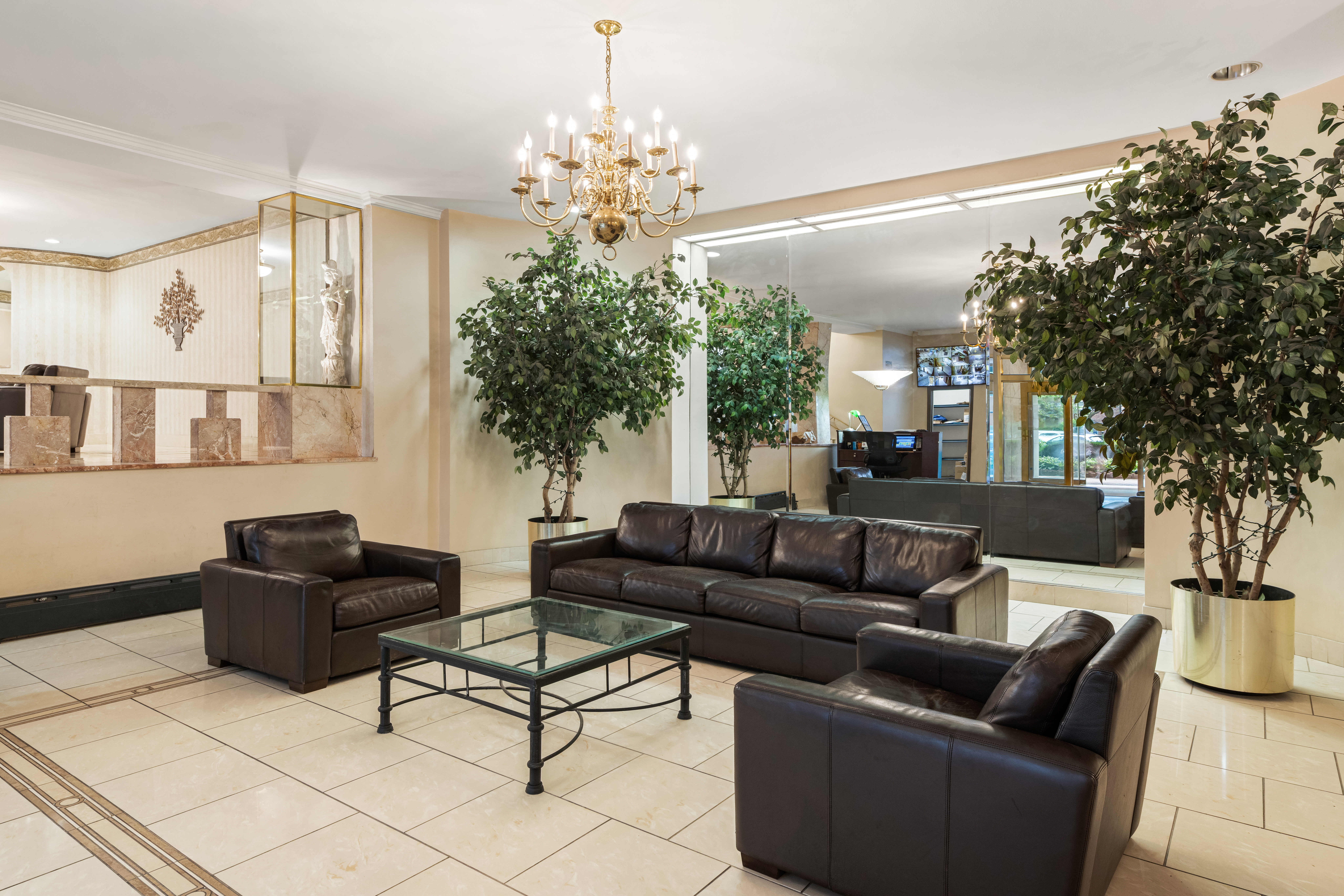 68-61 Yellowstone Boulevard, Unit 618 Queens, NY 11375 - Photo 10 of 13 a living room with furniture and a chandelier