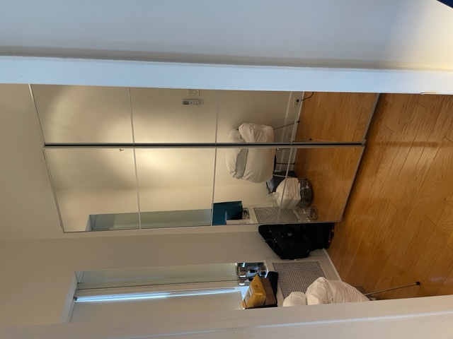 128 East 62nd Street, Unit 4F Manhattan, NY 10065 - Photo 7 of 9 a bedroom with a bed