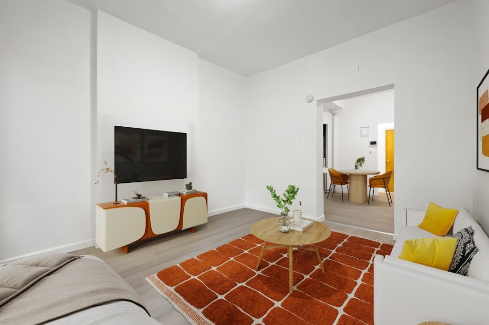 312 West 49th Street, Unit 1RW Manhattan, NY 10019 - Photo 7 of 12 a living room with furniture and a flat screen tv