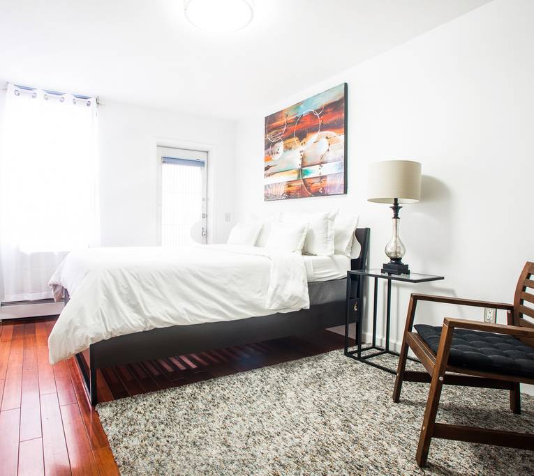 153 Stanton Street, Unit A1 Manhattan, NY 10002 - Photo 5 of 16 a bedroom with a bed and a desk