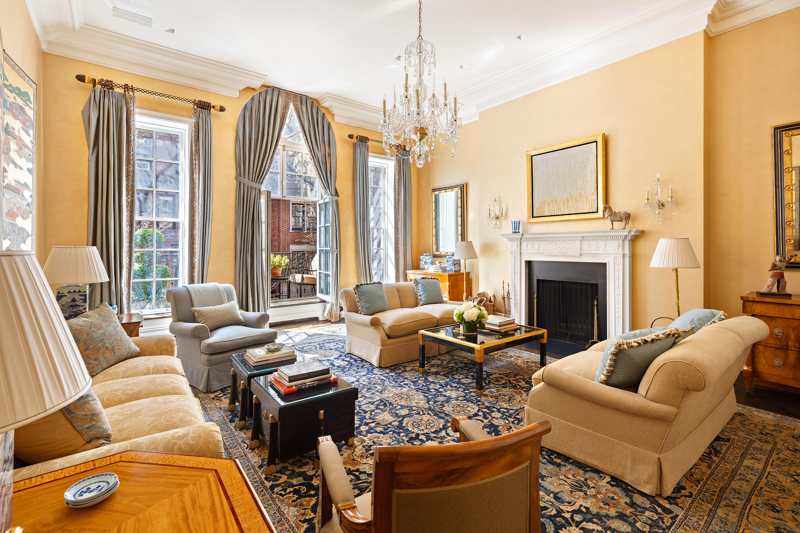 127 East 73rd Street Manhattan, NY 10021 - Photo 13 of 40 a living room with furniture fireplace and a large window