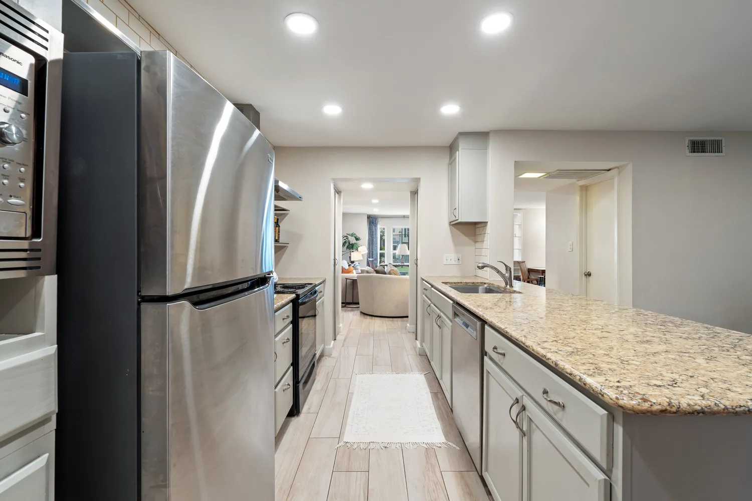 a kitchen with a stove and a refrigerator