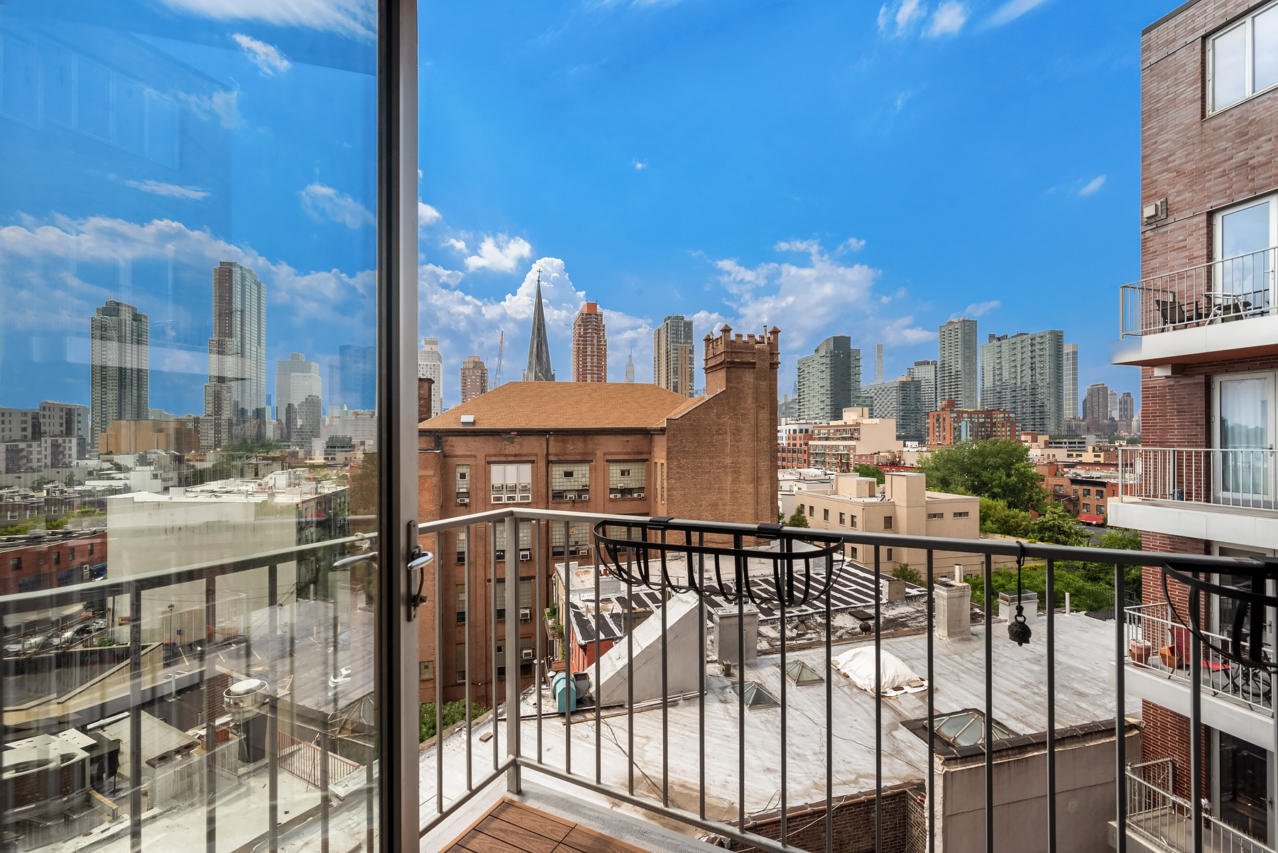 10-63 Jackson Avenue, Unit 7A Queens, NY 11101 - Photo 8 of 11 a view of a balcony with city view
