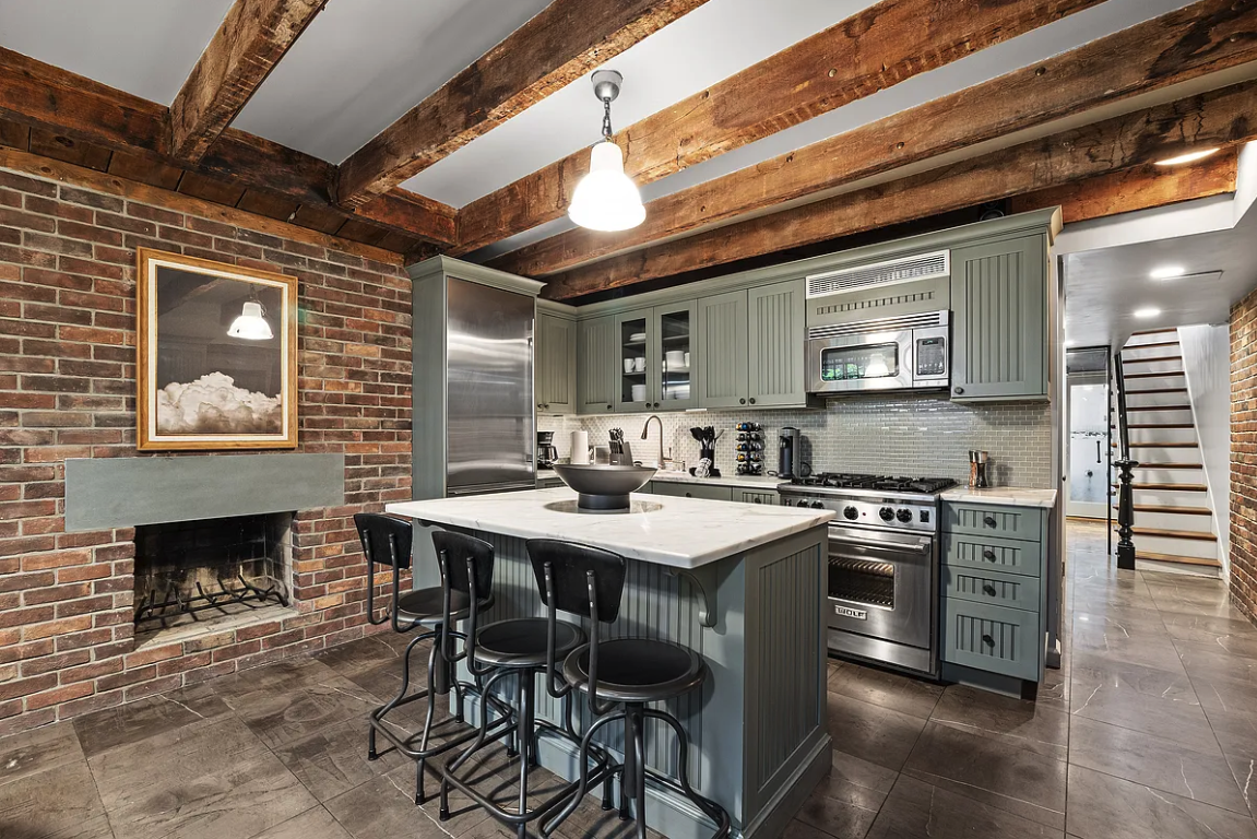 58 Downing Street Manhattan, NY 10014 - Photo 6 of 21 a kitchen with cabinets a sink and appliances
