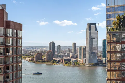 a view of a city with tall buildings