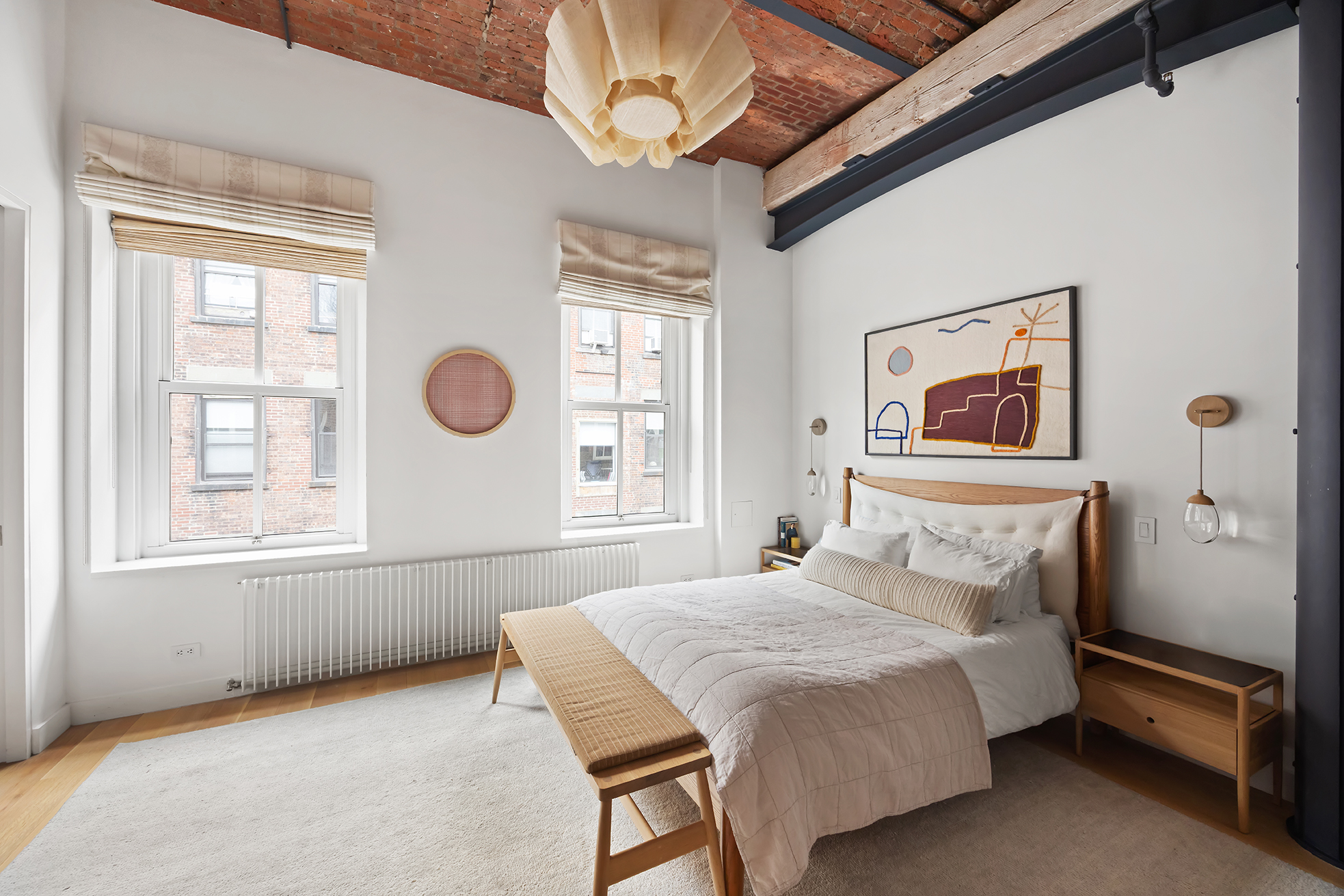 63 Greene Street, Unit PHB Manhattan, NY 10012 - Photo 12 of 17 a bedroom with a bed and a window