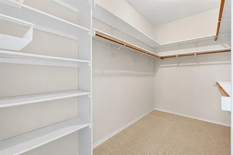 a view of an empty walk in closet