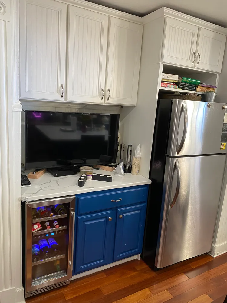 a kitchen with stainless steel appliances granite countertop a refrigerator stove and cabinets