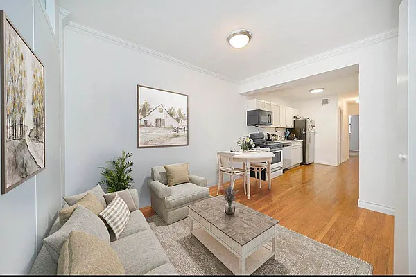 103 West 105th Street, Unit 2B Manhattan, NY 10025 - Photo 1 of 9 a living room with furniture and a table