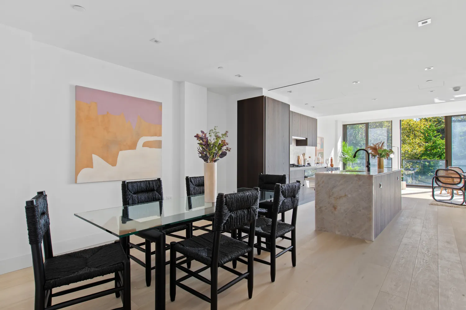 a view of a livingroom with furniture and a potted plant