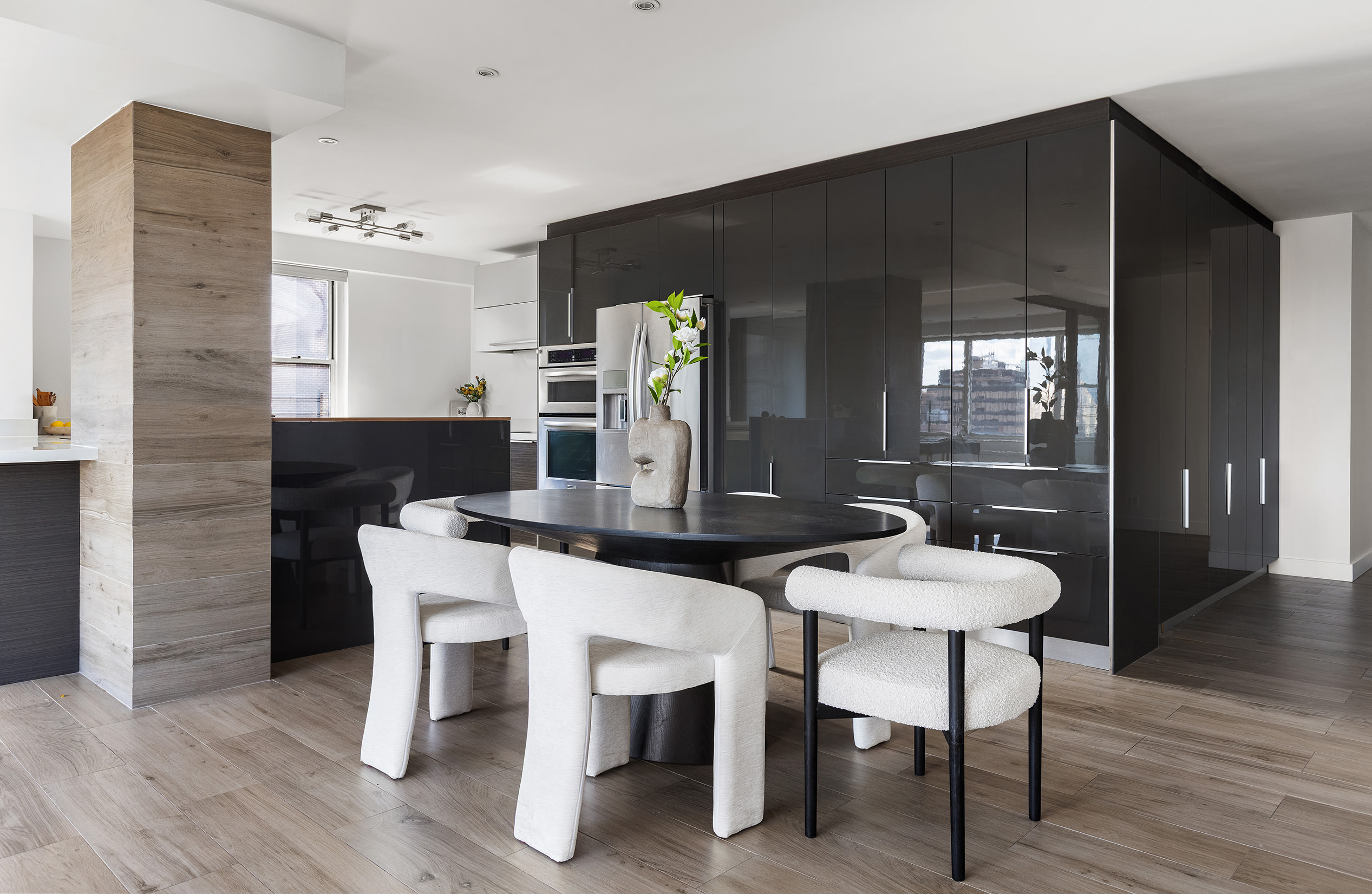 340 East 64th Street, Unit 19L Manhattan, NY 10065 - Photo 6 of 17 a view of a dining room with furniture and wooden floor
