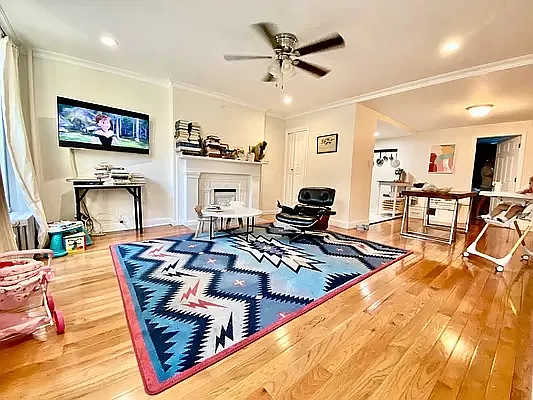 195 Atlantic Avenue, Unit 1 Brooklyn, NY 11201 - Photo 2 of 10 a living room with furniture and a flat screen tv