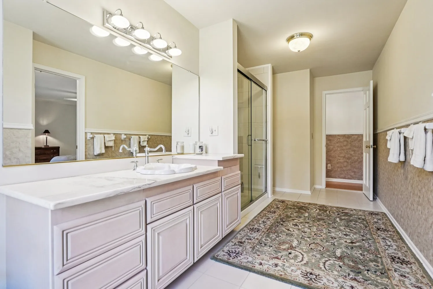 a bathroom with a sink a vanity and a mirror