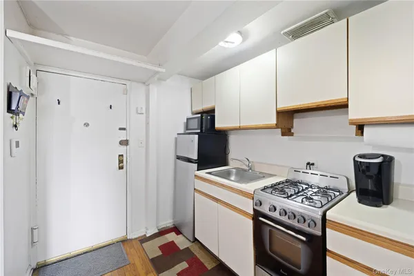 a kitchen with a stove and a refrigerator