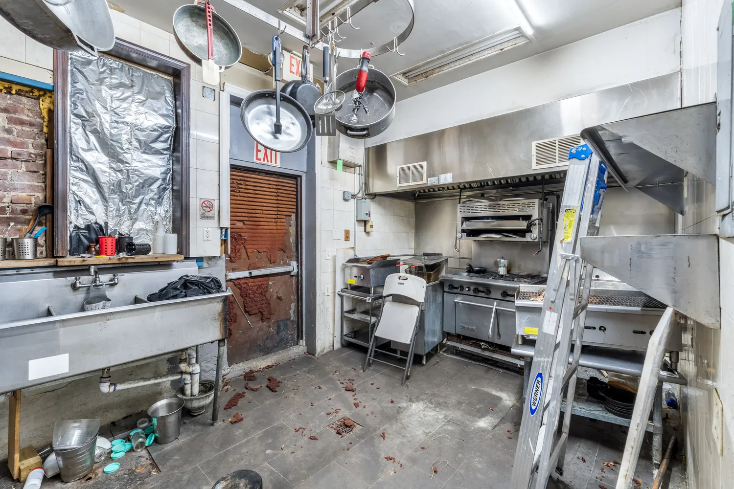 a kitchen with stainless steel appliances granite countertop a stove and cabinets