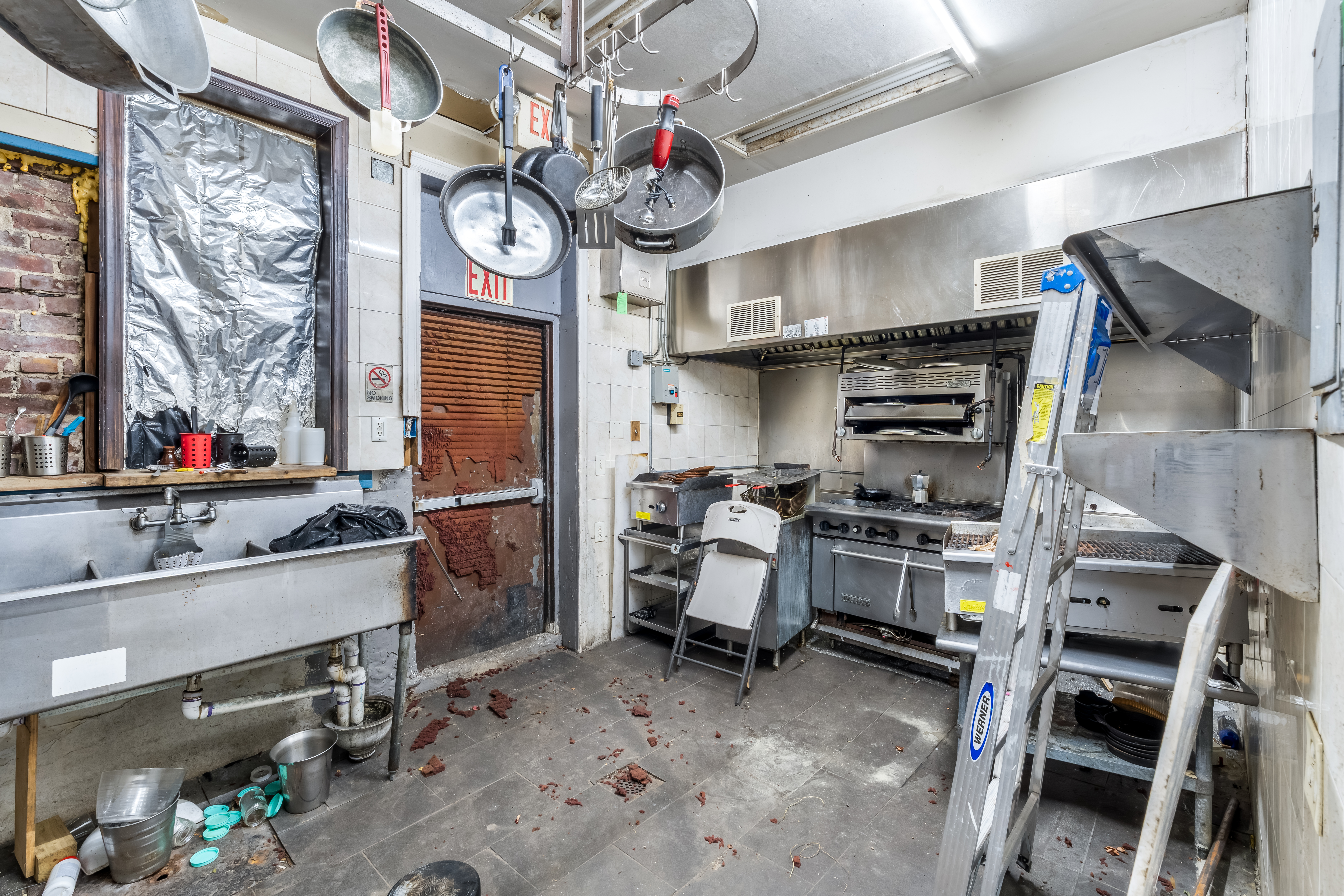 646 Newark Avenue, Unit COMMERCIAL Jersey City, NJ 07306 - Photo 17 of 35 a kitchen with stainless steel appliances granite countertop a stove and cabinets