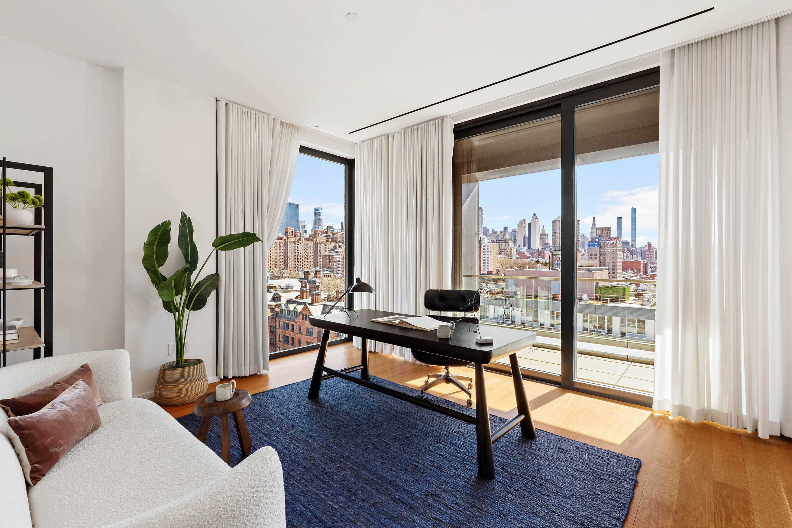 505 West 19th Street, Unit PH1 Manhattan, NY 10011 - Photo 16 of 26 a living room with furniture and a window
