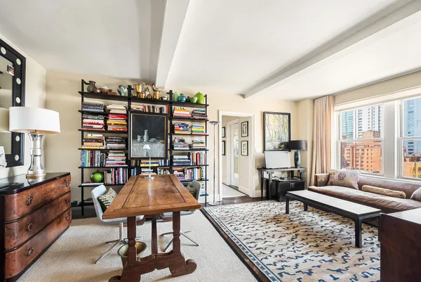 a living room with furniture and a rug