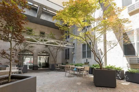 a view of a building with sitting area