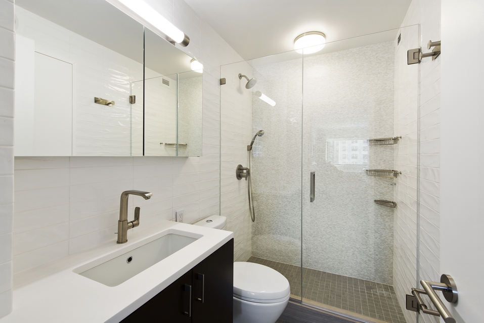 225 West 83rd Street, Unit 10K Manhattan, NY 10024 - Photo 8 of 21 a bathroom with a sink toilet and shower