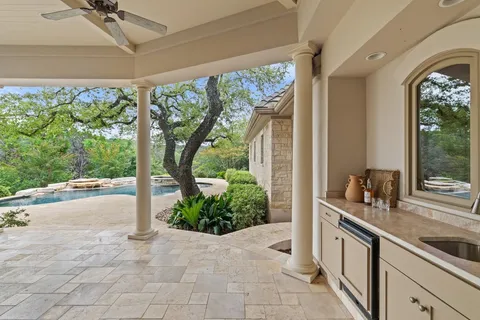 a view of a swimming pool with a yard
