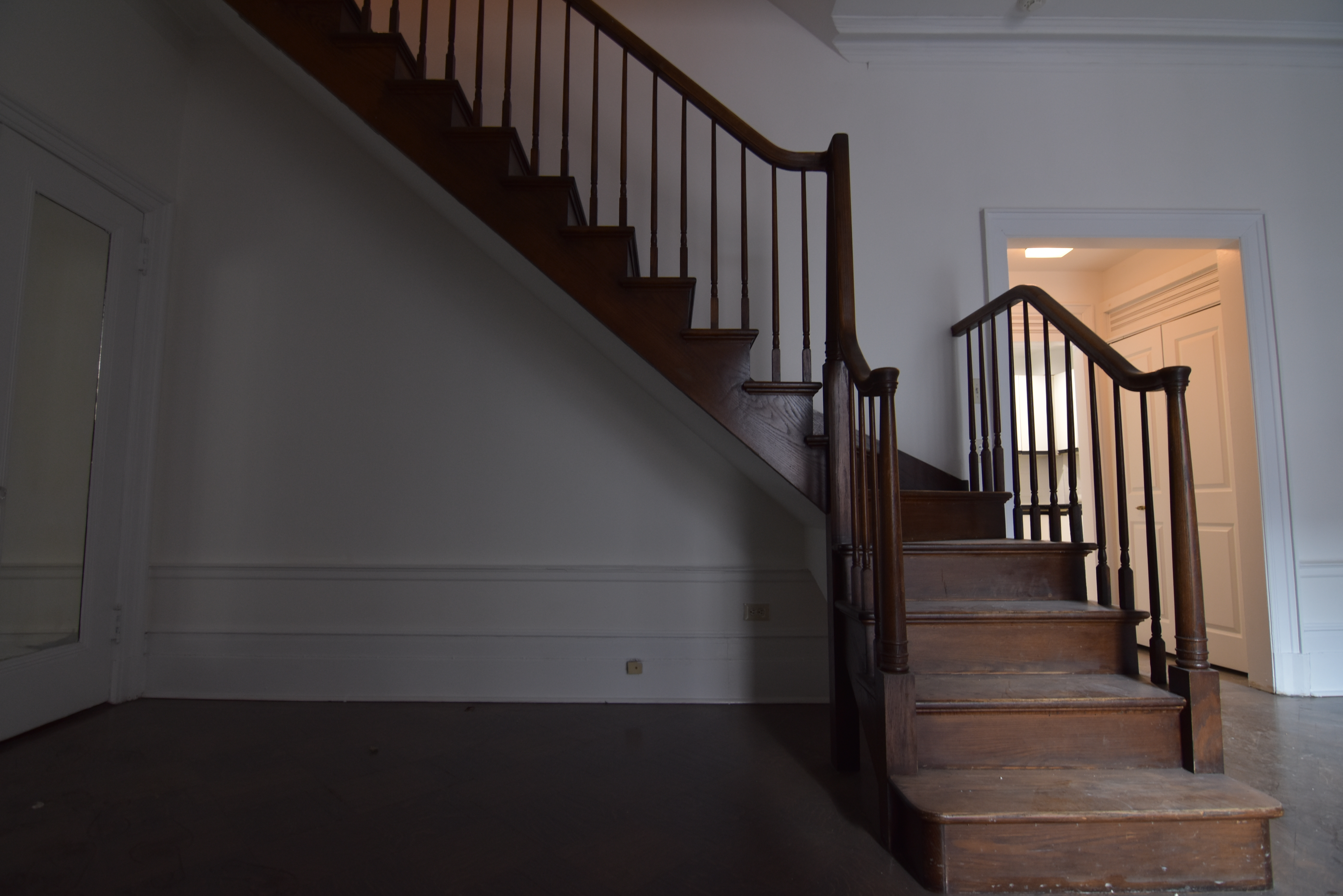 18 East 67th Street, Unit 2B/3B Manhattan, NY 10065 - Photo 7 of 18 a view of staircase with wooden floor and a window
