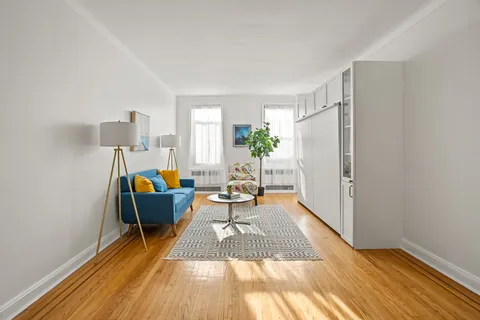 a living room with furniture and a rug