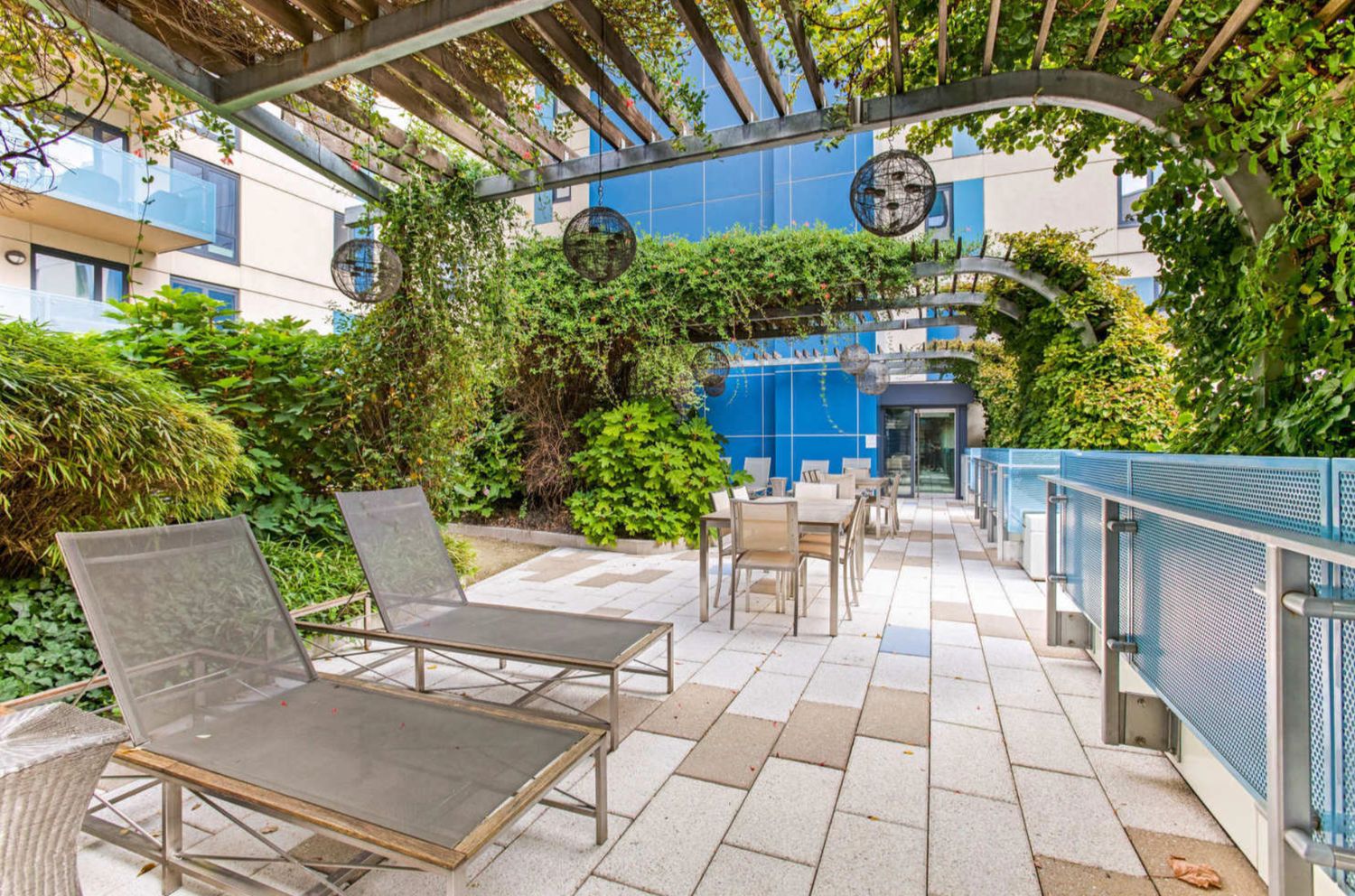454 West 54th Street, Unit PHC Manhattan, NY 10019 - Photo 16 of 27 a view of a patio with table and chairs and potted plants