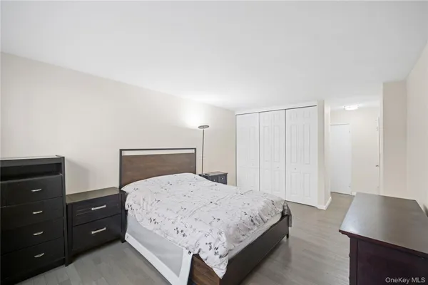 a bedroom with a bed and a bathroom in it