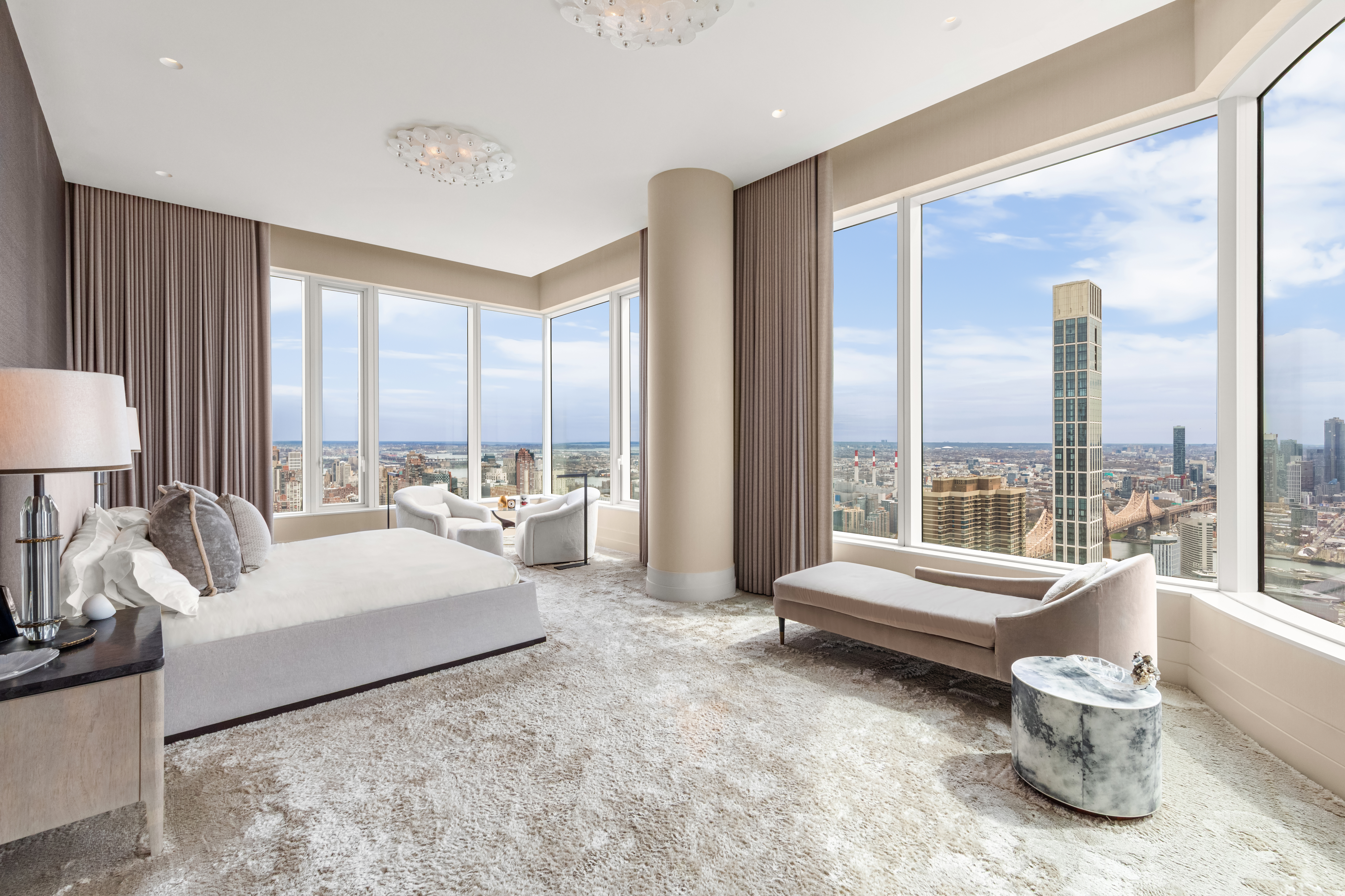 252 East 57th Street, Unit 60A Manhattan, NY 10022 - Photo 12 of 28 a spacious bedroom with a bed and large glass window