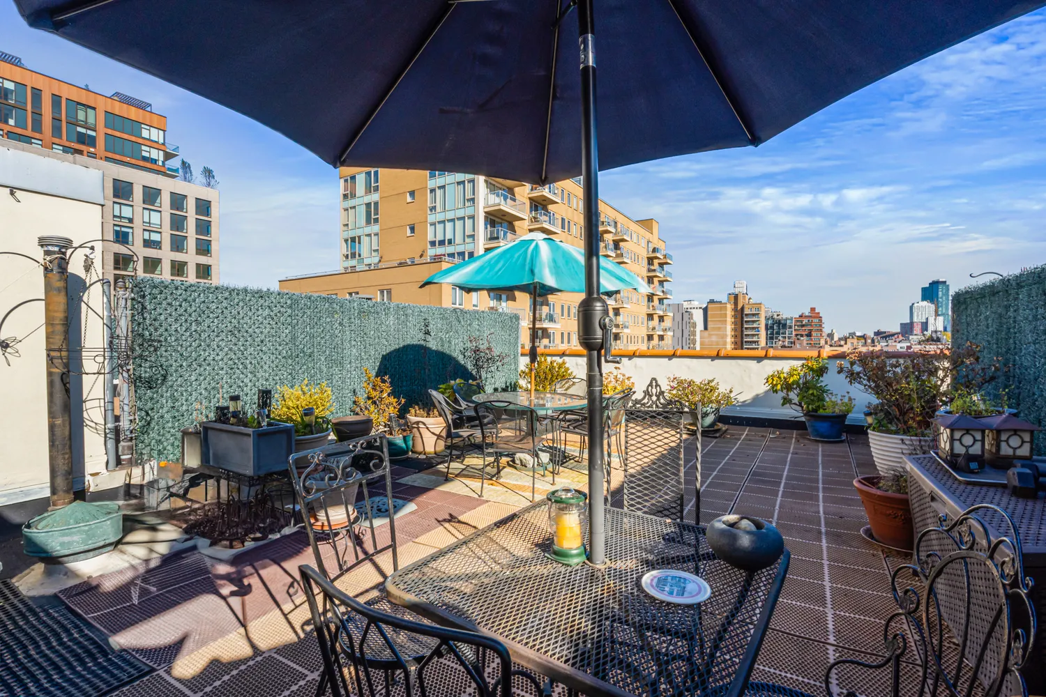 an outdoor space with furniture and umbrella