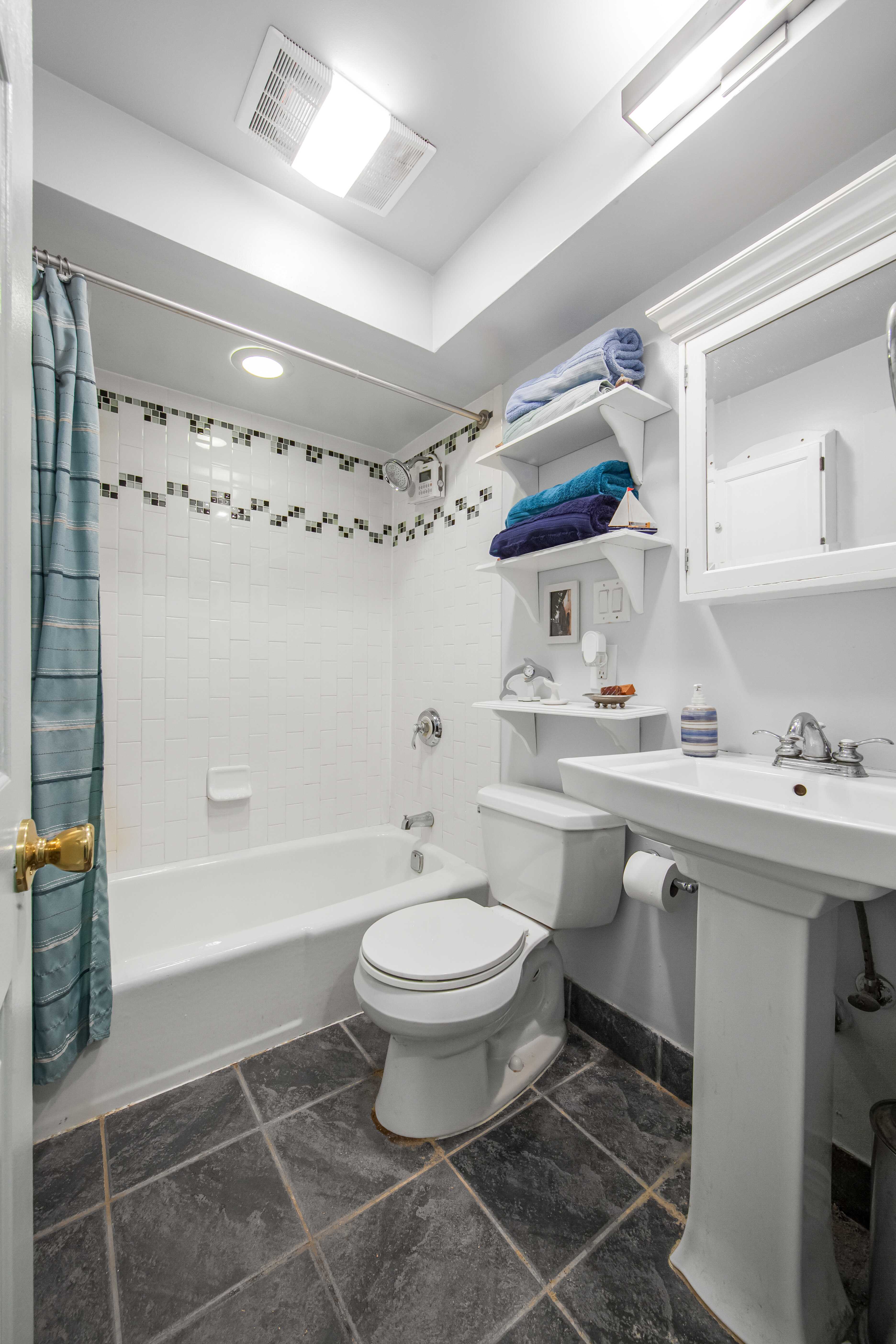 254 Park Place, Unit 4B Brooklyn, NY 11238 - Photo 5 of 12 a bathroom with a sink toilet and shower