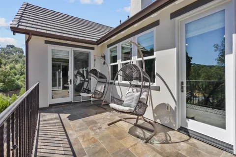 a view of a house with backyard and porch