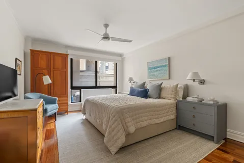 a bedroom with bed and window