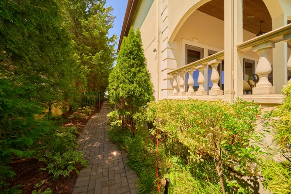 a front view of a house with a yard