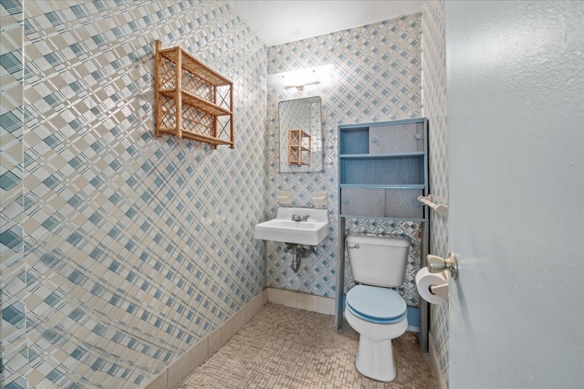 448 Neptune Avenue, Unit 16K Brooklyn, NY 11224 - Photo 15 of 28 a bathroom with a toilet and a shower curtain